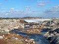 Peggy`s Cove, Nova Scotia, Canada in the aftermath of a late winter storm with views of the rocky shoreline and the waves Royalty Free Stock Photo