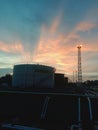 afternoon clouds over the crude oil tanks at my work site