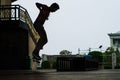 Skater boy under Rama 8 Bridge Bangkok