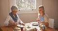 An afternoon at grandmas house. an attractive young woman visiting her gran for tea.