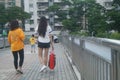 Shenzhen, China: In the afternoon, pedestrian landscapes on footbridges include off-duty men and women, workers, tourists and so o