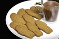 Afternoon snack comfort food. Gingerbread men biscuits and a cup