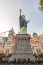 Afternoon sunny view of the Statue of Liberty wear Raiders football shirt and face mask