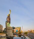 Afternoon sunny view of the Statue of Liberty wear Raiders football shirt and face mask