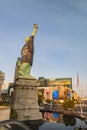 Afternoon sunny view of the Statue of Liberty wear Raiders football shirt and face mask