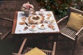 Afternoon tea basque burnt cheesecake and tea cup with teapot on wooden table. Royalty Free Stock Photo