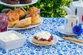 Afternoon tea with cakes and traditional English scones Royalty Free Stock Photo