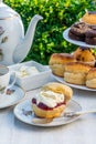 Afternoon tea with cakes and traditional English scones Royalty Free Stock Photo