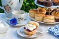 Afternoon tea with cakes and traditional English scones Royalty Free Stock Photo