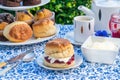 Afternoon tea with cakes and traditional English scones Royalty Free Stock Photo