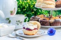 Afternoon tea with cakes and traditional English scones Royalty Free Stock Photo