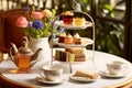 Afternoon tea in the restaurant garden, English tradition and luxury service, tea cups, cakes, scones, sanwiches and desserts, Royalty Free Stock Photo