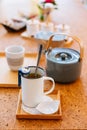 Afternoon Tea Set served hot water in gray pot with tin cup and tea infuser Royalty Free Stock Photo