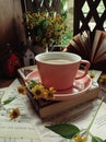 Afternoon tea time with wild flower and book Royalty Free Stock Photo