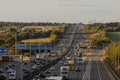 Afternoon traffic on the British motorway M1 near junction 9 and village Redbourn