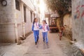 Shenzhen, China: two primary school girls go home on their way home from school Royalty Free Stock Photo