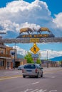 Afton, Wyoming, United States - June 07, 2018: The world`s larges elkhorn arch at the entrance of the town, with cars on Royalty Free Stock Photo