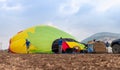 The maintenance team inflates the hot air balloon on the groundThe maintenance team inflates the hot air balloon on the ground bef