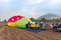The maintenance team inflates the hot air balloon on the ground before the flight at the hot air balloon festival