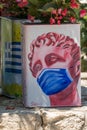 Greece, Afytos, Street Art Greek Statue with Surgical Mask Royalty Free Stock Photo
