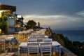 AFYTOS, GREECE - OCTOBER 16, 2020: Empty restaurants with terrace in the street Royalty Free Stock Photo