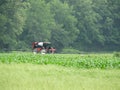Ag tractor used for liquid fertilizing of crop field Royalty Free Stock Photo