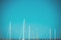 Against the backdrop of the blue sky and the horizon of the Balearic Sea, the white masts of yachts Royalty Free Stock Photo