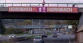 guy raises his foot on advertising reckoning He stands on bridge, ready to jump