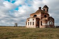 Against the background of clouds and blue sky destroyed old Church in the village Royalty Free Stock Photo