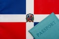 Against the background of the flag of the Dominican Republic is a passport