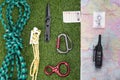 Against the background of a green lawn, there is a set of items for the expedition, a climbing rope, a map of the area, tourist Royalty Free Stock Photo