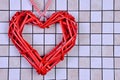 Against the background of small multi-colored tiles on the left side there is a decorative red heart. On the right there Royalty Free Stock Photo