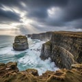 Against the cliff base under a cloudy sky, with beams of sunlight breakin Royalty Free Stock Photo