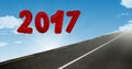 2017 against a composite image 3D of road in sky Royalty Free Stock Photo