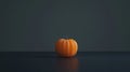 Against a dark background, an orange physalis fruit on a textured surface emphasizes its unique form and vibrant hue Royalty Free Stock Photo