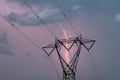 High voltage power line with lightning and thunderstorm on the evening sky background.