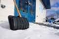 Against slippery conditions, the use of a snow shovel for freeing the street from snow .