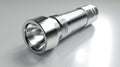 Against a white background, a modern silver metal LED flashlight that is both lightweight and portable is placed Royalty Free Stock Photo