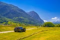 AGARN, SWITZERLAND - APR 2017: Gray grey Toyota Avensis T25 Fields and meadows with Swiss Alps mountains, Agarn, Leuk, Visp,