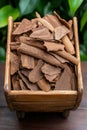Agarwood chips in a wooden container. Royalty Free Stock Photo