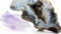 Agate geode with crystals and amethyst macro photography. Semiprecious stones isolated on a white background. Healing properties Royalty Free Stock Photo