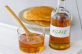 Agave syrup and a plate of pancakes. Royalty Free Stock Photo