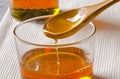 Agave syrup pouring on a glass. Royalty Free Stock Photo