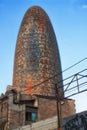 Agbar tower behind a shanty town in Barcelona