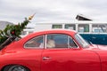 AGDE, FRANCE - SEPTEMBER 9, 2017: Red car with a Christmas tree. Close-up.