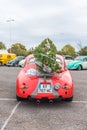 AGDE, FRANCE - SEPTEMBER 9, 2017: View of a red retro car. Back view. Vertical. Copy space for text.