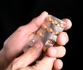 Close up of senior man hands holding pills Royalty Free Stock Photo