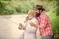 Age is only a number. mature man fisher celebrate retirement. family, granddad and drandson fishing. hobby and Royalty Free Stock Photo