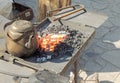 Age-old kettle on the forge fire Royalty Free Stock Photo