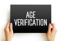 Age Verification text displayed on a card held by hands, emphasizing identity confirmation, online restrictions, digital security Royalty Free Stock Photo